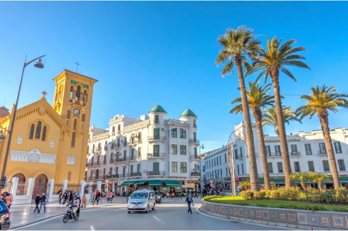 Spanish Quarter buildings, palm trees and a church tower in Tetouan