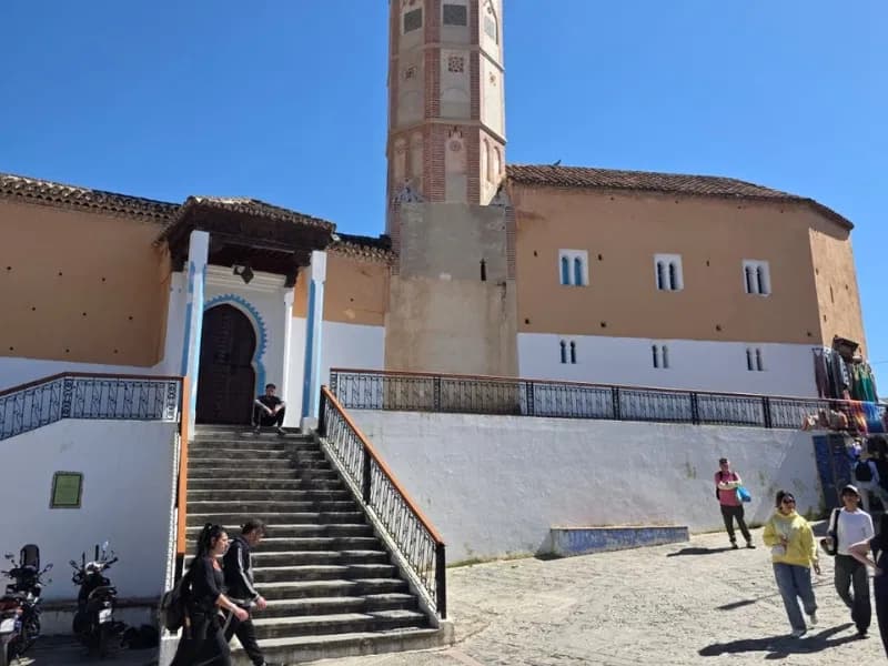 Mosque with an octagonal minaret beside a stairway in Chefchaouen