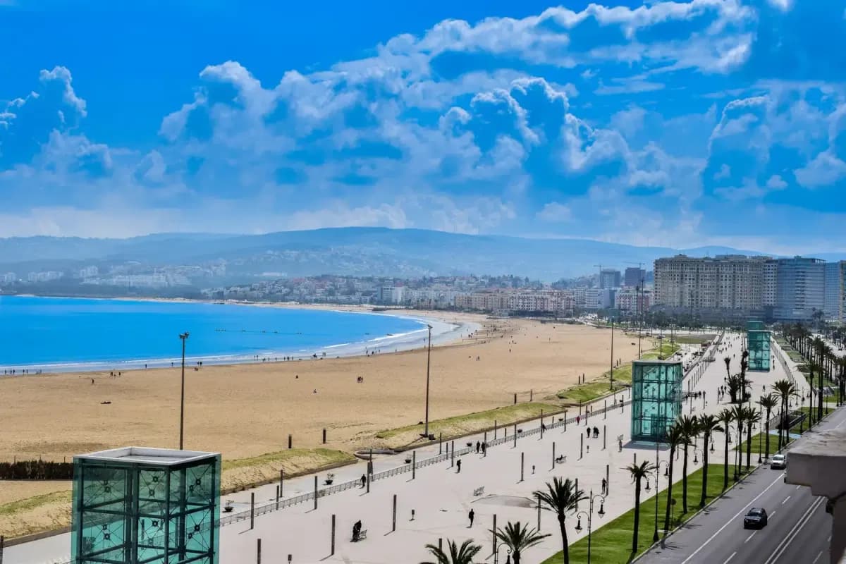 Wide sandy beach and seafront promenade along Tangier bay